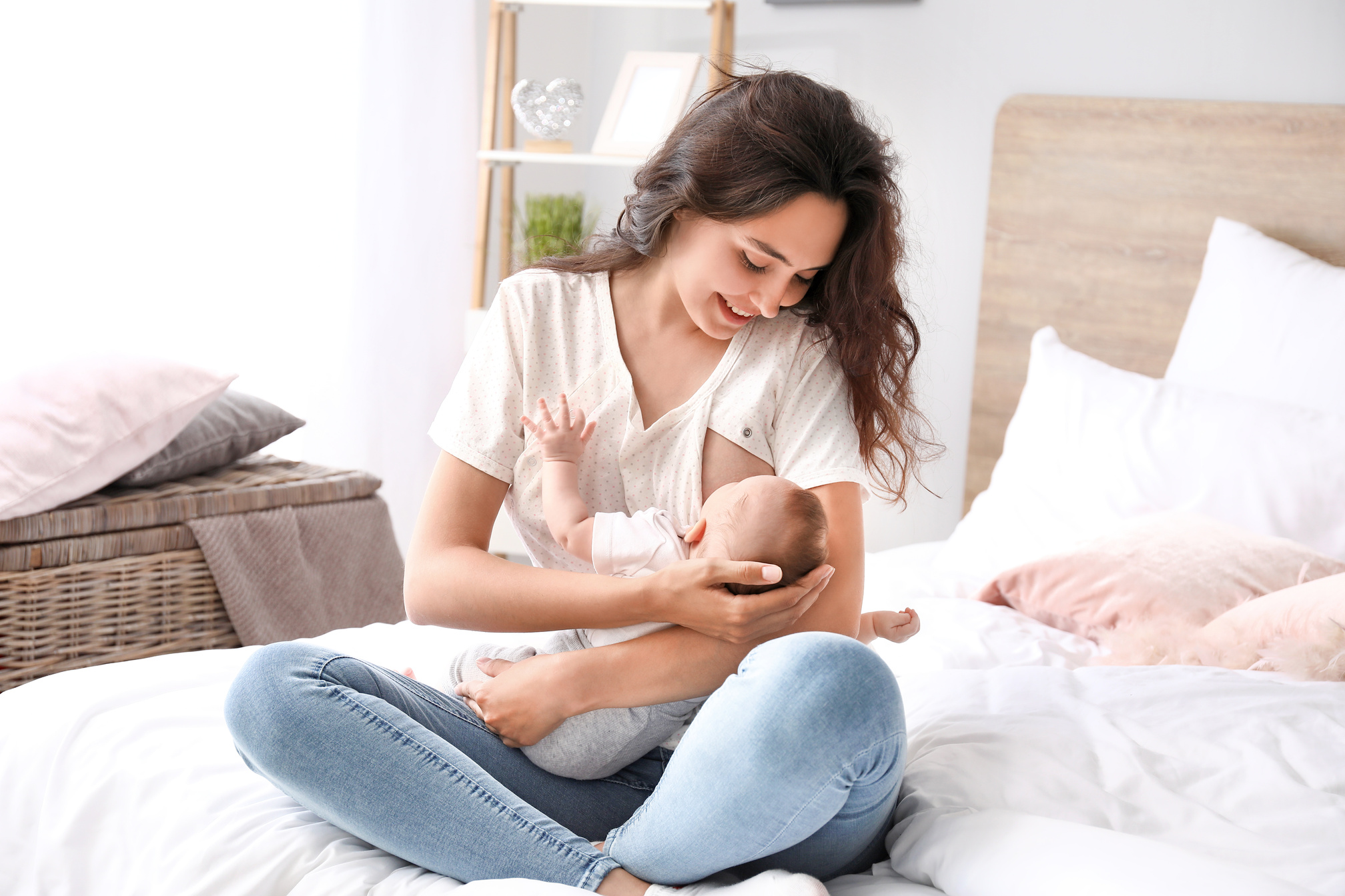 Young Woman Breastfeeding Her Baby at Home